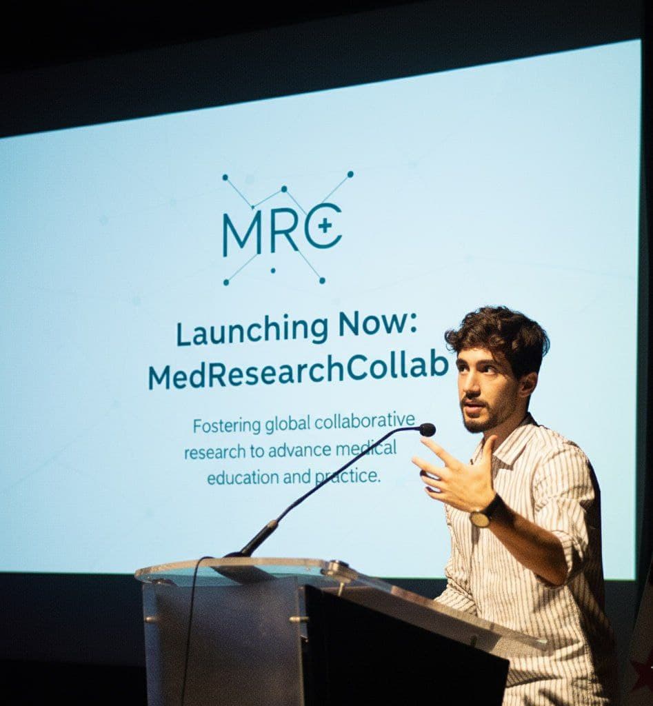 Youssef Ahmed speaking at a podium
